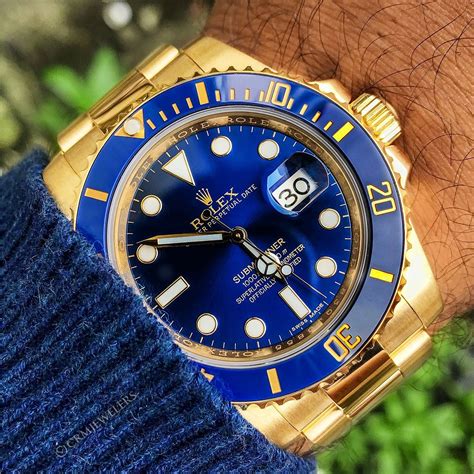 gold rolex with blue face.